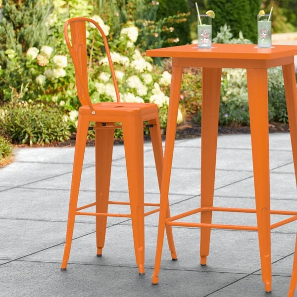 LT&S Alloy Series Lancaster Table & Seating Alloy Series Orange Metal Indoor / Outdoor Industrial Cafe Barstool With Vertical Slat Back And Drain Hole Seat 1 LT&S Alloy Series Lancaster Table & Seating Alloy Series Orange Metal Indoor / Outdoor Industrial Cafe Barstool With Vertical Slat Back And Drain Hole Seat