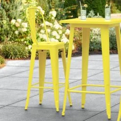 LT&S Alloy Series Lancaster Table & Seating Alloy Series Yellow Metal Indoor / Outdoor Industrial Cafe Barstool With Vertical Slat Back And Drain Hole Seat
