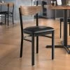 LT&S Boomerang Series Lancaster Table & Seating Boomerang Black Finish Chair With 2 1/2" Black Vinyl Padded Seat And Vintage Wood Back