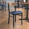 LT&S Boomerang Series Lancaster Table & Seating Boomerang Black Finish Chair With 2 1/2" Navy Vinyl Padded Seat And Vintage Wood Back