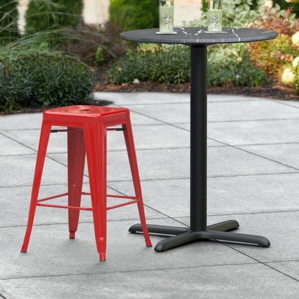 LT&S Alloy Series Lancaster Table & Seating Alloy Series Red Stackable Metal Indoor / Outdoor Industrial Cafe Counter Height Stool With Drain Hole Seat 1 LT&S Alloy Series Lancaster Table & Seating Alloy Series Red Stackable Metal Indoor / Outdoor Industrial Cafe Counter Height Stool With Drain Hole Seat