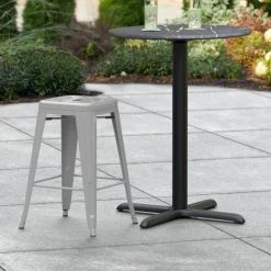 LT&S Alloy Series Lancaster Table & Seating Alloy Series Silver Stackable Metal Indoor / Outdoor Industrial Cafe Counter Height Stool With Drain Hole Seat