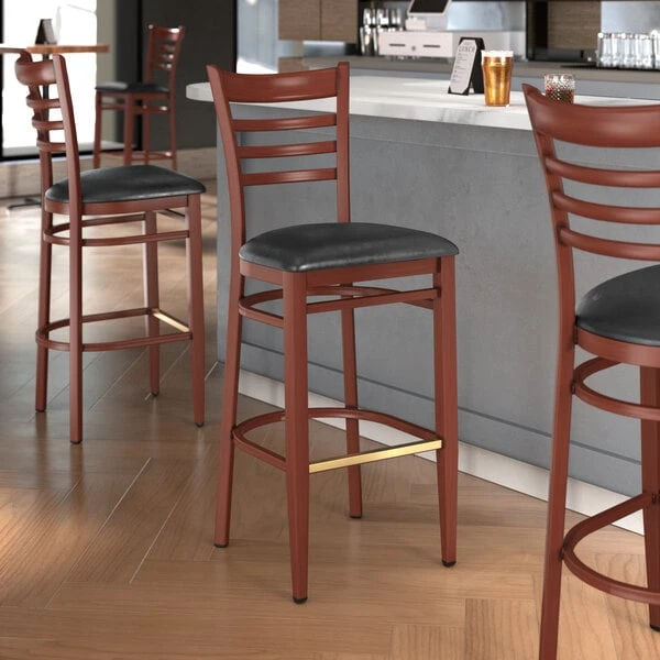 LT&S Spartan Series Lancaster Table & Seating Spartan Series Bar Height Metal Ladder Back Chair With Mahogany Wood Grain Finish And Black Vinyl Seat 1 LT&S Spartan Series Lancaster Table & Seating Spartan Series Bar Height Metal Ladder Back Chair With Mahogany Wood Grain Finish And Black Vinyl Seat