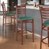 LT&S Spartan Series Lancaster Table & Seating Spartan Series Bar Height Metal Ladder Back Chair With Mahogany Wood Grain Finish And Green Vinyl Seat