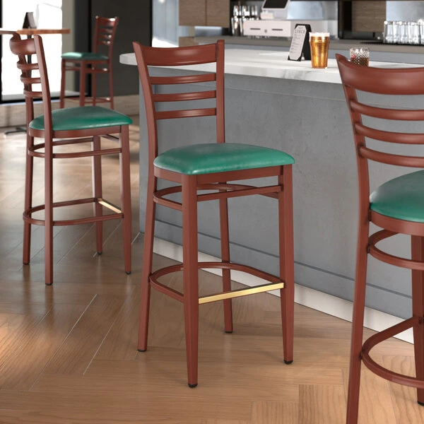 LT&S Spartan Series Lancaster Table & Seating Spartan Series Bar Height Metal Ladder Back Chair With Mahogany Wood Grain Finish And Green Vinyl Seat 1 LT&S Spartan Series Lancaster Table & Seating Spartan Series Bar Height Metal Ladder Back Chair With Mahogany Wood Grain Finish And Green Vinyl Seat