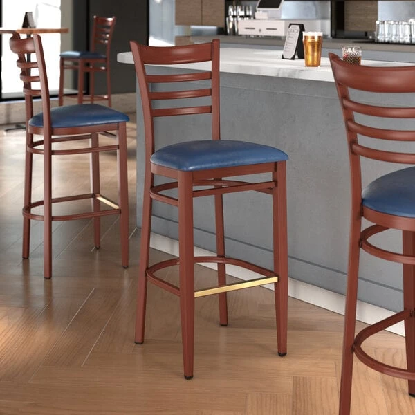 LT&S Spartan Series Lancaster Table & Seating Spartan Series Bar Height Metal Ladder Back Chair With Mahogany Wood Grain Finish And Navy Vinyl Seat 1 LT&S Spartan Series Lancaster Table & Seating Spartan Series Bar Height Metal Ladder Back Chair With Mahogany Wood Grain Finish And Navy Vinyl Seat
