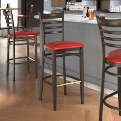 LT&S Spartan Series Lancaster Table & Seating Spartan Series Bar Height Metal Ladder Back Chair With Walnut Wood Grain Finish And Red Vinyl Seat