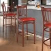 LT&S Spartan Series Lancaster Table & Seating Spartan Series Bar Height Metal Slat Back Chair With Mahogany Wood Grain Finish And Red Vinyl Seat