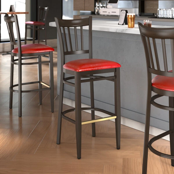 LT&S Spartan Series Lancaster Table & Seating Spartan Series Bar Height Metal Slat Back Chair With Walnut Wood Grain Finish And Red Vinyl Seat 1 LT&S Spartan Series Lancaster Table & Seating Spartan Series Bar Height Metal Slat Back Chair With Walnut Wood Grain Finish And Red Vinyl Seat