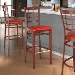 LT&S Spartan Series Lancaster Table & Seating Spartan Series Bar Height Metal Window Back Chair With Mahogany Wood Grain Finish And Red Vinyl Seat