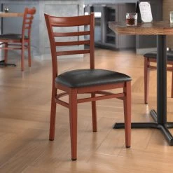 LT&S Spartan Series Lancaster Table & Seating Spartan Series Metal Ladder Back Chair With Mahogany Wood Grain Finish And Black Vinyl Seat