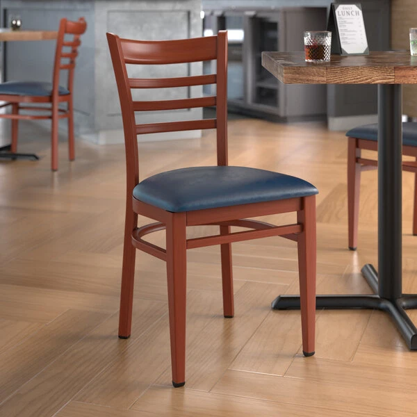 LT&S Spartan Series Lancaster Table & Seating Spartan Series Metal Ladder Back Chair With Mahogany Wood Grain Finish And Navy Vinyl Seat 1 LT&S Spartan Series Lancaster Table & Seating Spartan Series Metal Ladder Back Chair With Mahogany Wood Grain Finish And Navy Vinyl Seat