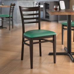 LT&S Spartan Series Lancaster Table & Seating Spartan Series Metal Ladder Back Chair With Walnut Wood Grain Finish And Green Vinyl Seat