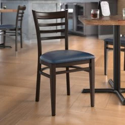 LT&S Spartan Series Lancaster Table & Seating Spartan Series Metal Ladder Back Chair With Walnut Wood Grain Finish And Navy Vinyl Seat