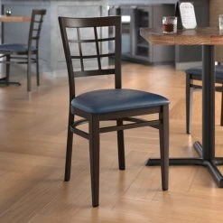 LT&S Spartan Series Lancaster Table & Seating Spartan Series Metal Window Back Chair With Walnut Wood Grain Finish And Navy Vinyl Seat